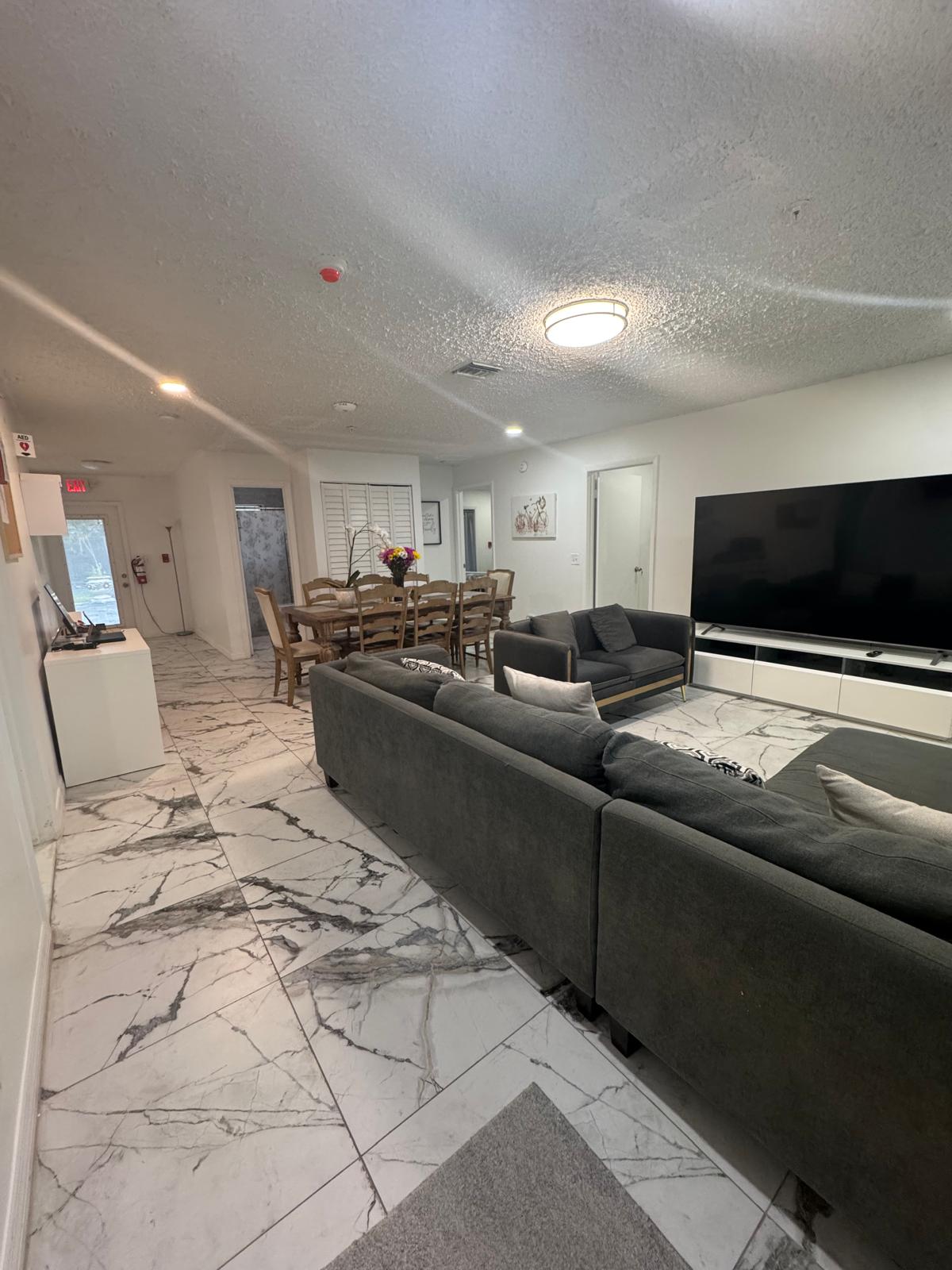 The open living and dining area at Angel Mary C Group Home in Davie, Florida