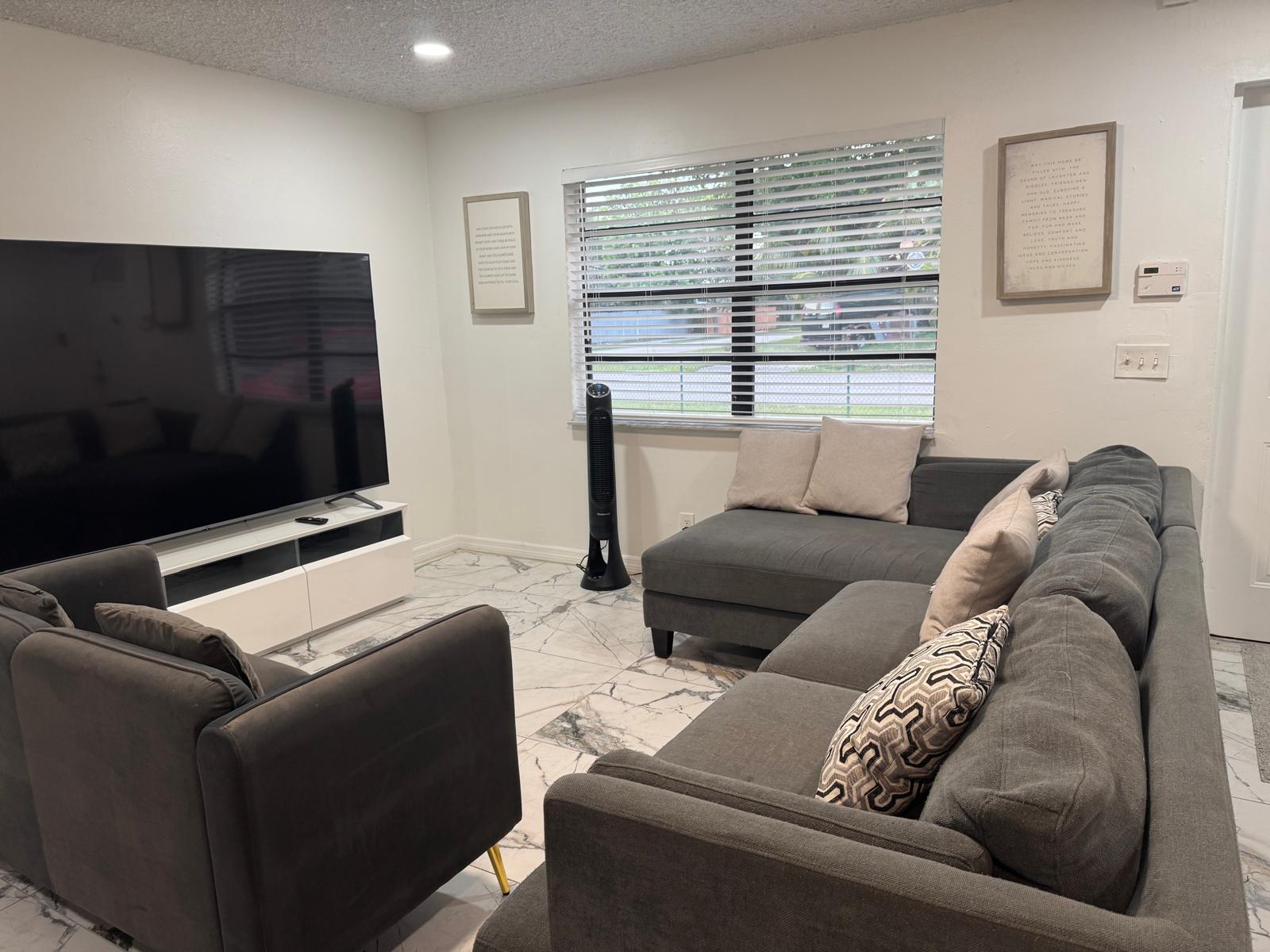 The living room at Angel Mary C Group Home in Davie, Florida